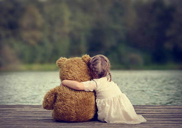 A girl Playing with her Fluffy Kids' Toys in a comforting way. 